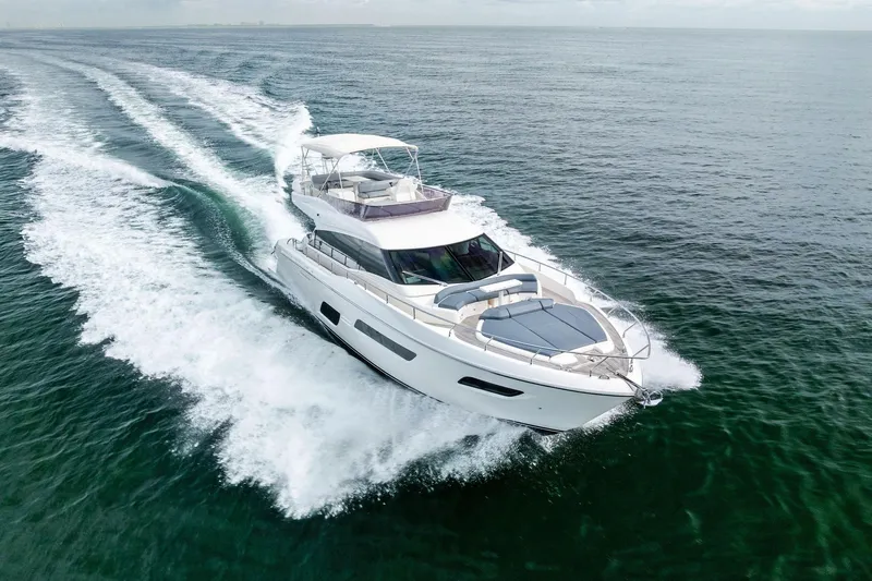 Acqua Yacht Photos Pics 2018 Ferretti Yachts 550 cruising on open water, aerial view.