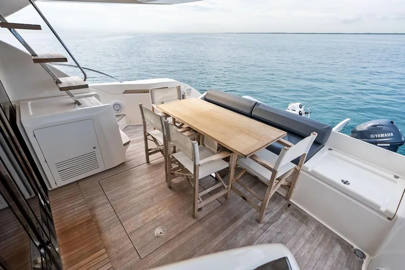 Acqua Yacht Photos Pics 2018 Ferretti Yachts 550 deck with dining area overlooking the ocean.
