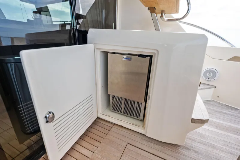 Acqua Yacht Photos Pics 2018 Ferretti Yachts 550, onboard mini fridge, open door, wooden deck.