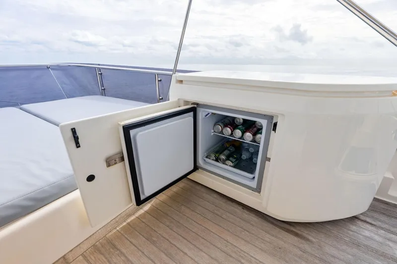 Acqua Yacht Photos Pics Open mini fridge on 2018 Ferretti Yachts 550, stocked with beverages on deck.