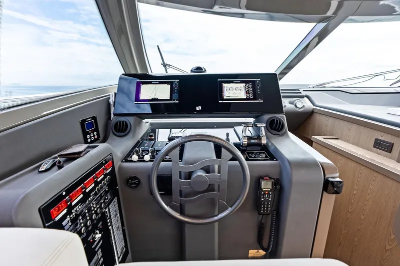 Acqua Yacht Photos Pics Helm of 2018 Ferretti Yachts 550 with modern navigation equipment and controls.
