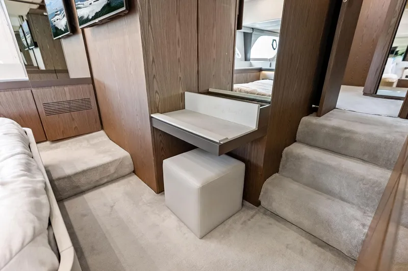 Acqua Yacht Photos Pics Luxurious interior of 2018 Ferretti Yachts 550 with elegant wood and carpeted design.