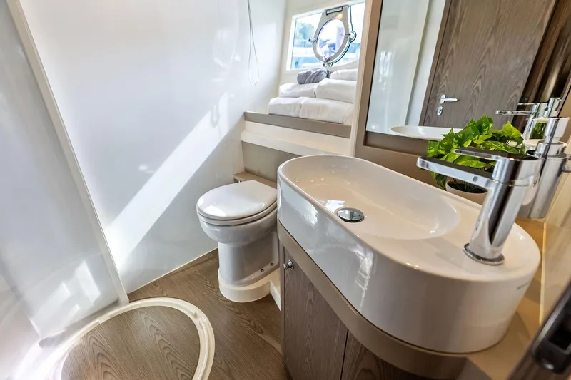 Acqua Yacht Photos Pics Luxurious bathroom in 2018 Ferretti Yachts 550, featuring modern sink and toilet.