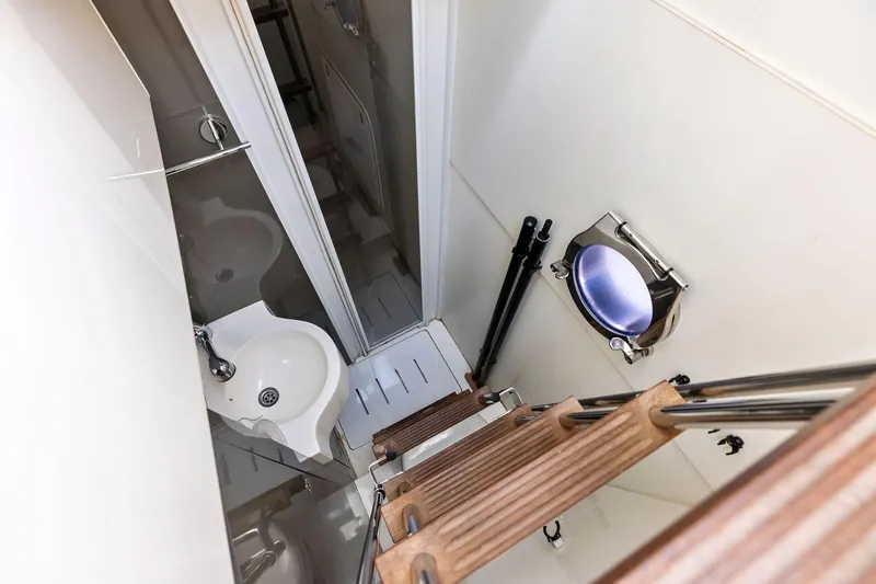 Acqua Yacht Photos Pics Compact bathroom in 2018 Ferretti Yachts 550 with sink and porthole.