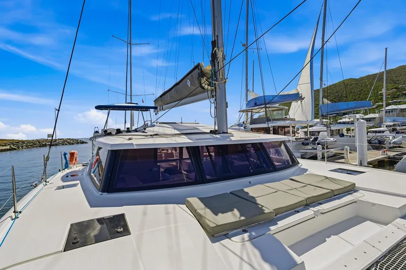 Nauti Mollie Yacht Photos Pics 2020 Fountaine Pajot Astrea 42 Catamaran docked at marina under clear blue sky.