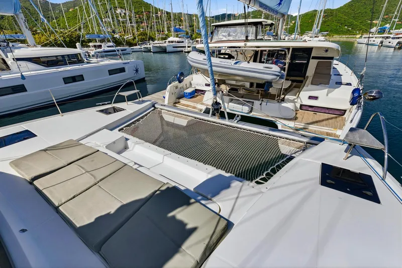 Nauti Mollie Yacht Photos Pics 2020 Fountaine Pajot Astrea 42 Catamaran docked in a scenic marina setting.