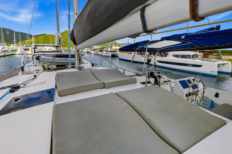 Nauti Mollie Yacht Photos Pics 2020 Fountaine Pajot Astrea 42 Catamaran docked, featuring spacious deck and modern design.