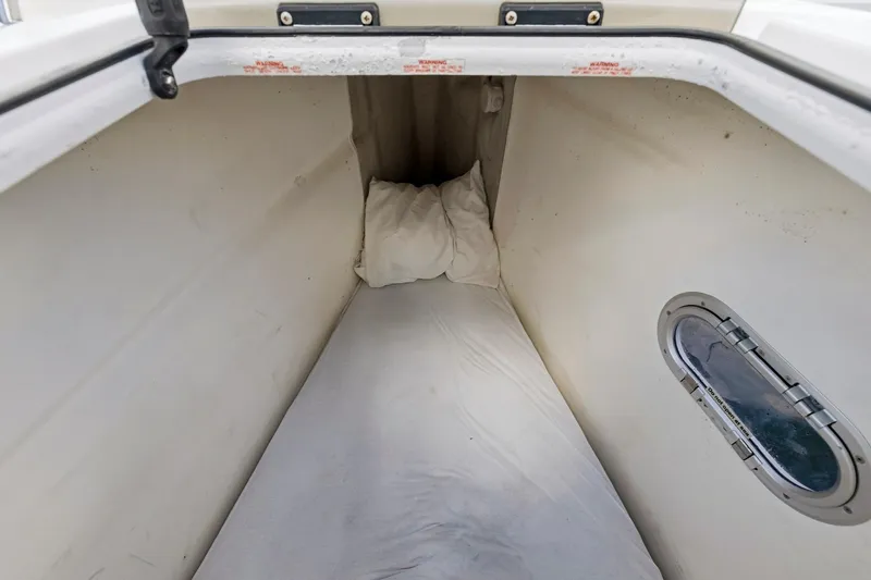 Nauti Mollie Yacht Photos Pics Interior cabin of 2020 Fountaine Pajot Astrea 42 Catamaran with bedding and porthole.