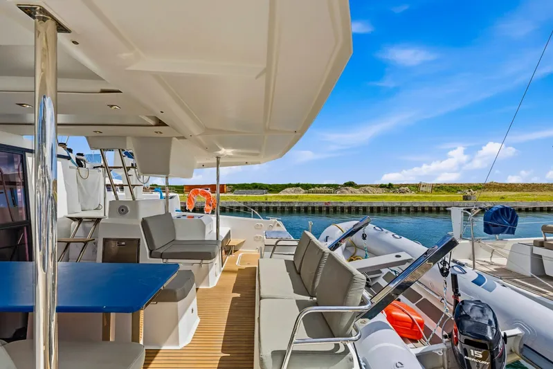 Nauti Mollie Yacht Photos Pics 2020 Fountaine Pajot Astrea 42 Catamaran deck with seating and scenic waterway view.