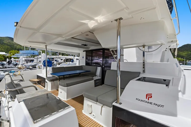 Nauti Mollie Yacht Photos Pics 2020 Fountaine Pajot Astrea 42 Catamaran with spacious outdoor seating and modern design.