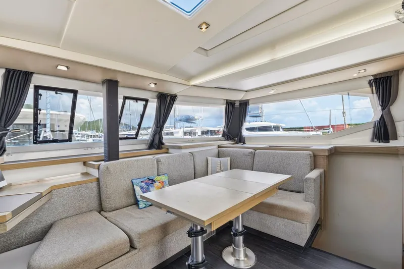 Nauti Mollie Yacht Photos Pics Luxurious interior of 2020 Fountaine Pajot Astrea 42 Catamaran with modern seating and windows.