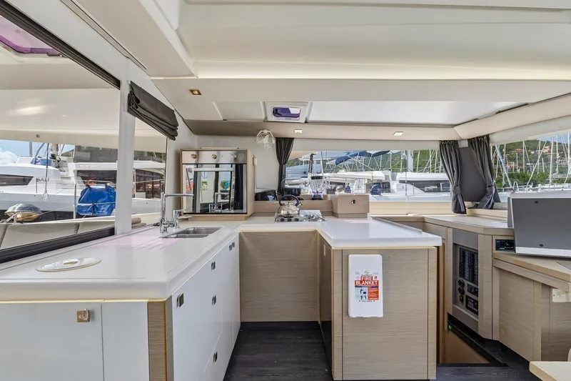 Nauti Mollie Yacht Photos Pics Modern kitchen interior of 2020 Fountaine Pajot Astrea 42 Catamaran with sleek design and ample light.