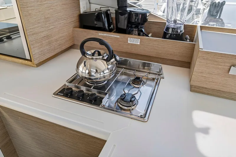 Nauti Mollie Yacht Photos Pics Modern kitchen in 2020 Fountaine Pajot Astrea 42 Catamaran with stove and kettle.