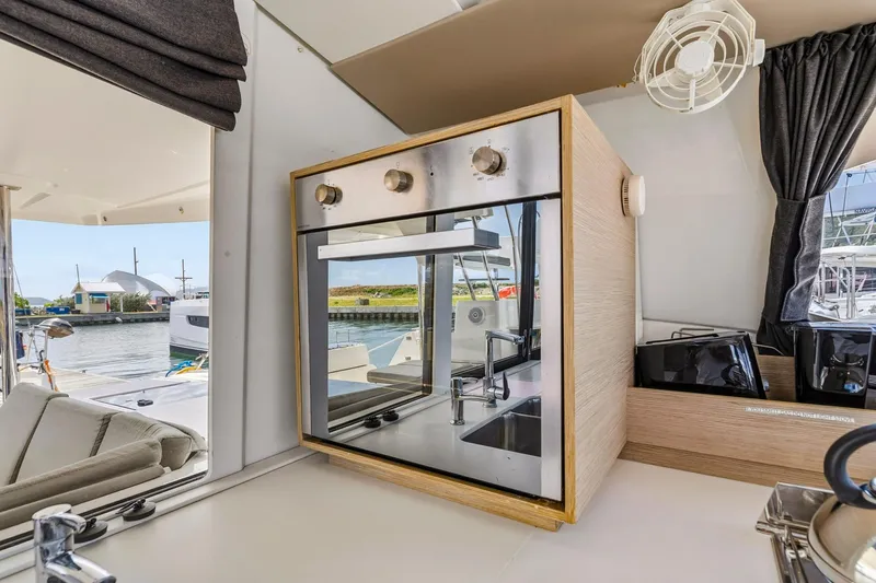 Nauti Mollie Yacht Photos Pics Modern kitchen interior of 2020 Fountaine Pajot Astrea 42 Catamaran with oven and sink.