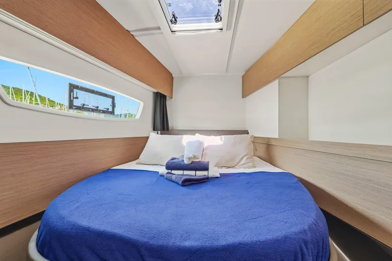 Nauti Mollie Yacht Photos Pics 2020 Fountaine Pajot Astrea 42 Catamaran cabin with cozy bed and skylight.