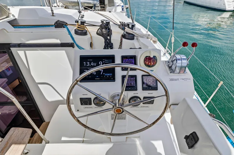 Nauti Mollie Yacht Photos Pics Helm station of 2020 Fountaine Pajot Astrea 42 Catamaran with navigation instruments.