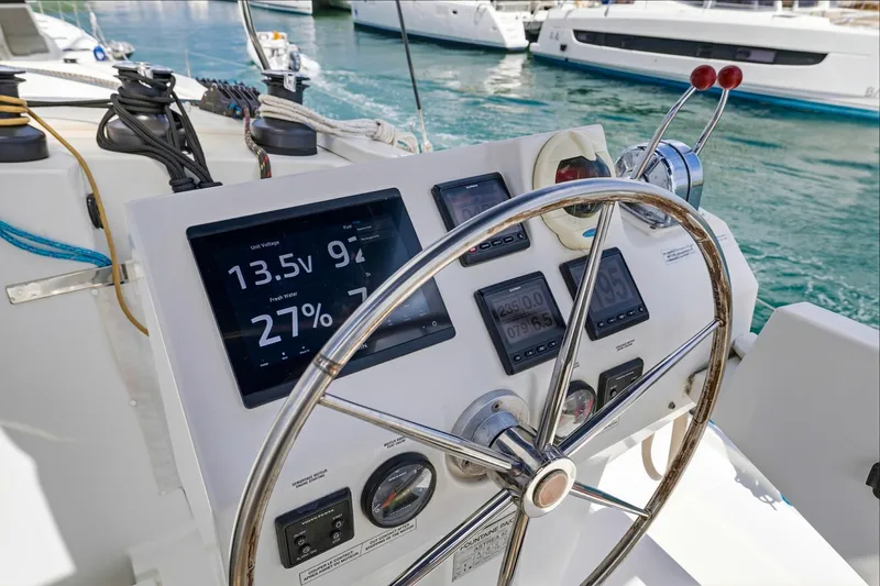 Nauti Mollie Yacht Photos Pics Steering wheel and control panel of 2020 Fountaine Pajot Astrea 42 Catamaran.