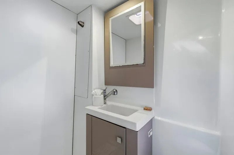 Nauti Mollie Yacht Photos Pics Modern bathroom in 2020 Fountaine Pajot Astrea 42 Catamaran with sleek sink and mirror.