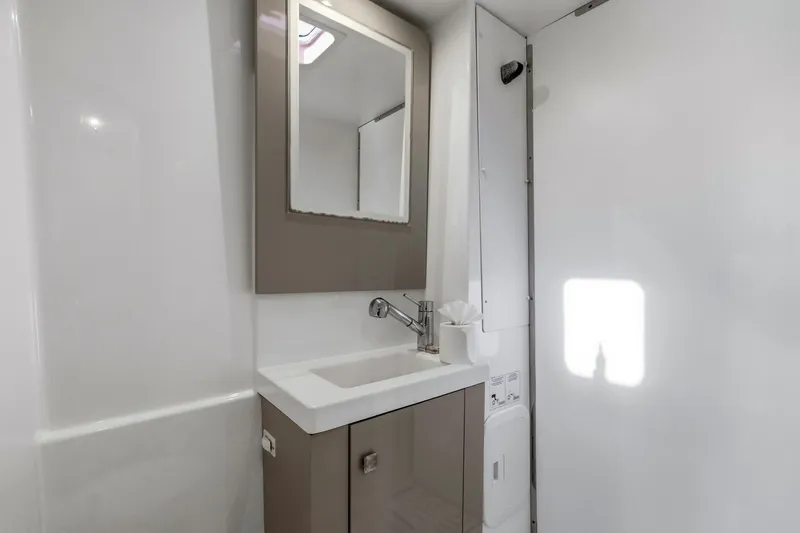Nauti Mollie Yacht Photos Pics Modern bathroom in 2020 Fountaine Pajot Astrea 42 Catamaran with sleek sink and mirror.