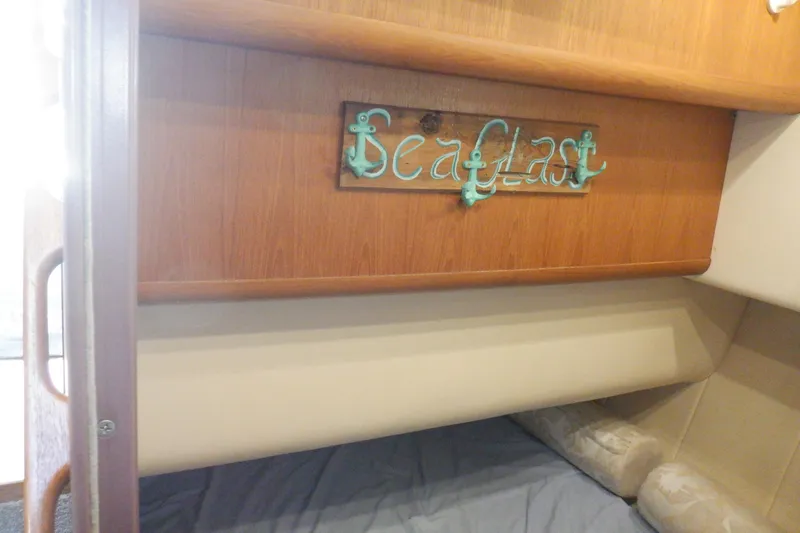 Seaglass Yacht Photos Pics Interior cabin of 1999 Mainship 350 Trawler with decorative "Sea Glass" sign.