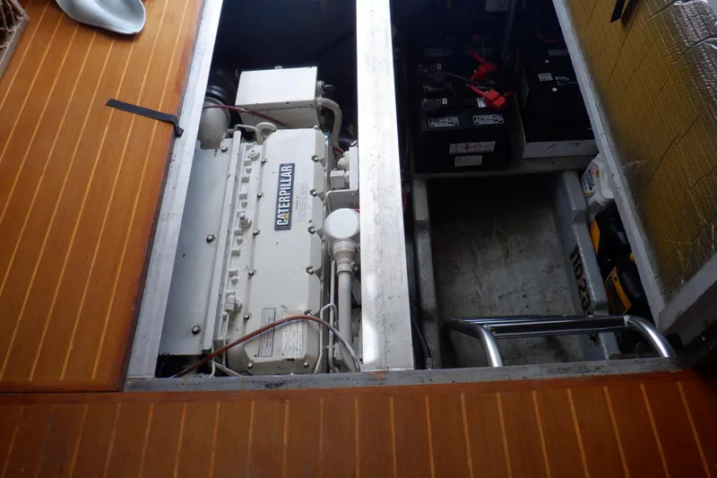 Seaglass Yacht Photos Pics Engine compartment of a 1999 Mainship 350 Trawler with Caterpillar engine and batteries.