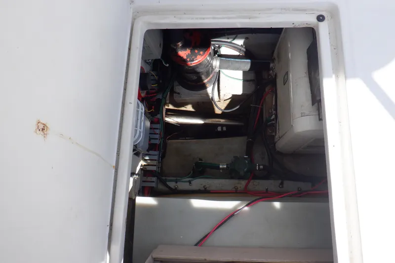 Seaglass Yacht Photos Pics Engine compartment of a 1999 Mainship 350 Trawler, showing mechanical components and wiring.