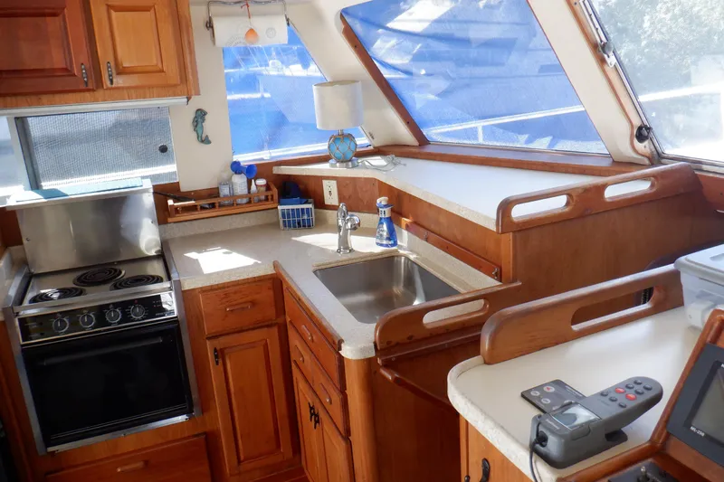 Seaglass Yacht Photos Pics Interior of 1999 Mainship 350 Trawler with kitchen and sink.