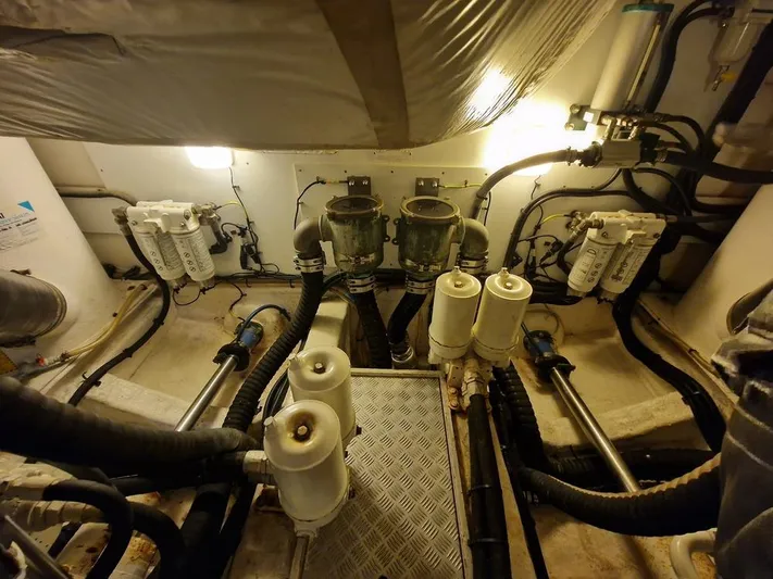  Yacht Photos Pics Engine room of a 2006 Princess V58 yacht, showcasing filters and piping systems.