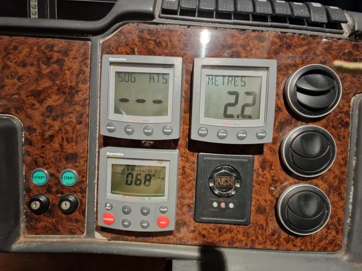  Yacht Photos Pics Control panel of a 2006 Princess V58 yacht with digital displays and switches.