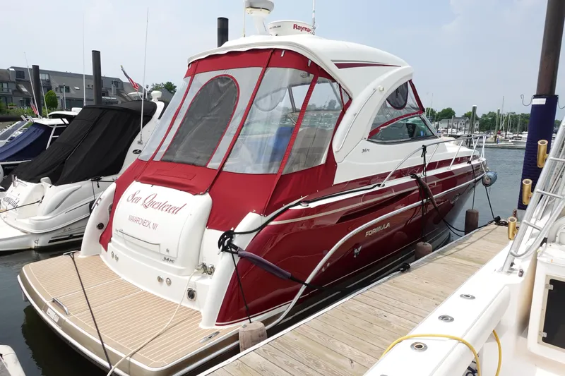  Yacht Photos Pics 2016 Formula 34 Cruiser docked at marina, featuring red and white design.