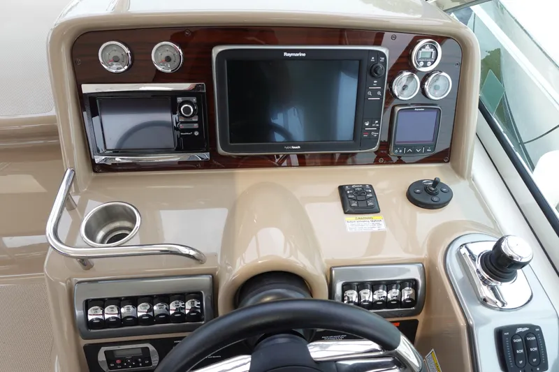  Yacht Photos Pics Control panel of a 2016 Formula 34 Cruiser boat with navigation and control systems.