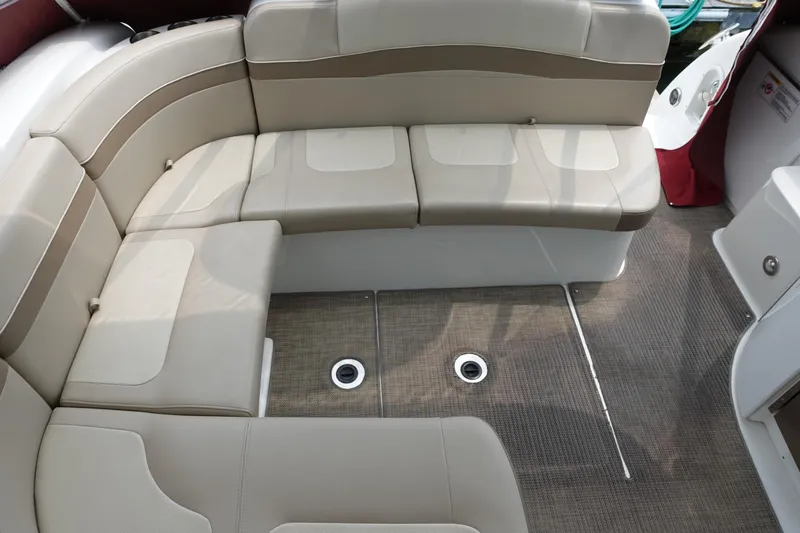  Yacht Photos Pics 2016 Formula 34 Cruiser boat interior with beige seating and carpeted floor.