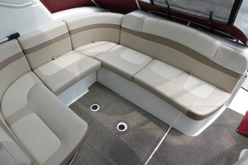  Yacht Photos Pics 2016 Formula 34 Cruiser interior seating with beige upholstery and carpeted flooring.