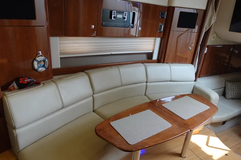  Yacht Photos Pics 2016 Formula 34 Cruiser interior with leather seating and wooden table.
