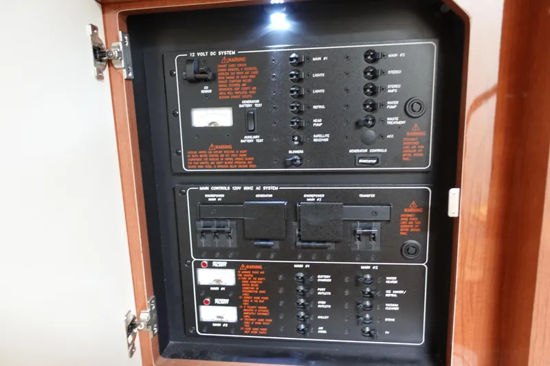  Yacht Photos Pics Control panel of a 2016 Formula 34 Cruiser boat, featuring electrical systems and switches.