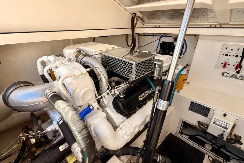  Yacht Photos Pics Engine room of 2001 Cabo 35 Express boat with Caterpillar engine components.