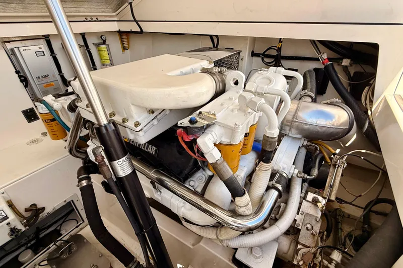  Yacht Photos Pics Engine room of a 2001 Cabo 35 Express boat, showcasing detailed machinery and components.