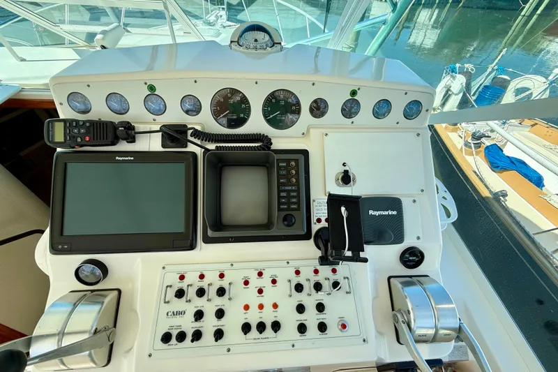  Yacht Photos Pics Control panel of a 2001 Cabo 35 Express boat with navigation instruments.