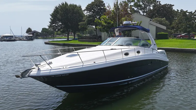 Don't Blink Yacht Photos Pics 2005 Sea Ray 340 Sundancer boat docked on a calm lake.