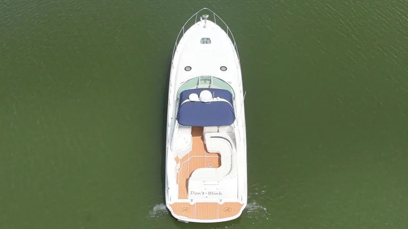 Don't Blink Yacht Photos Pics Aerial view of 2005 Sea Ray 340 Sundancer boat on green water.