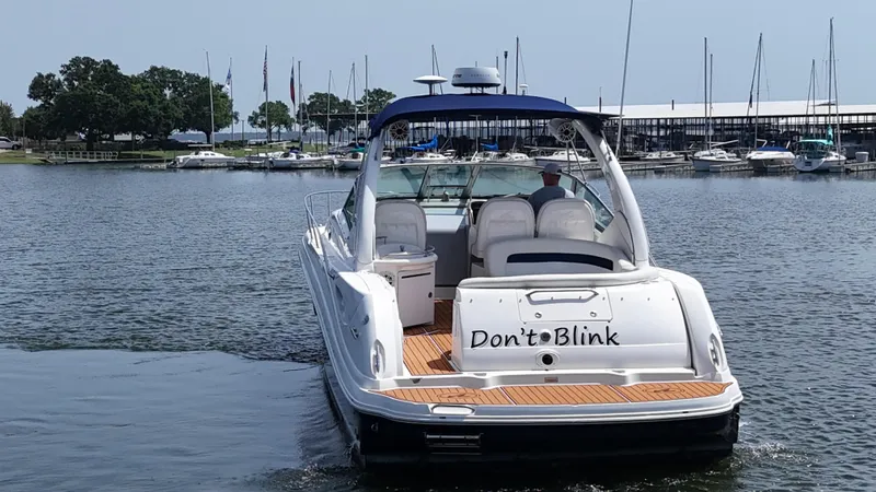 Don't Blink Yacht Photos Pics 2005 Sea Ray 340 Sundancer boat named "Don't Blink" on a calm marina.