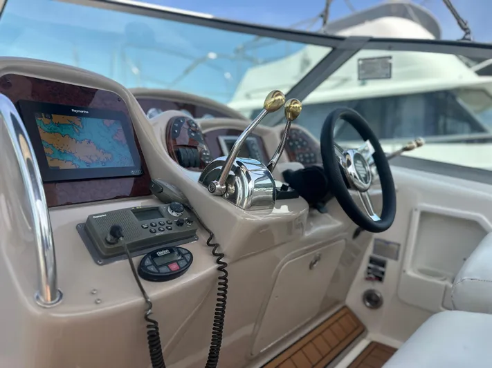 Don't Blink Yacht Photos Pics 2005 Sea Ray 340 Sundancer helm with navigation equipment and steering wheel.