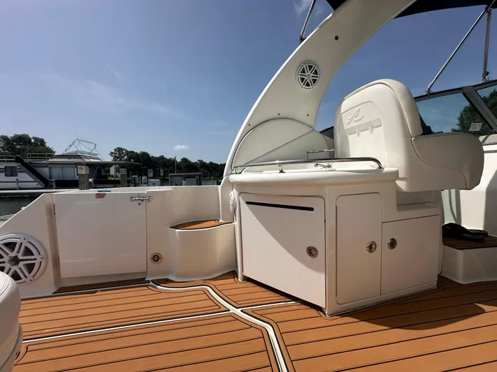 Don't Blink Yacht Photos Pics 2005 Sea Ray 340 Sundancer boat interior with sleek seating and wooden deck.