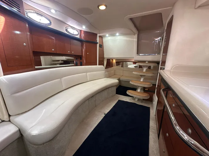 Don't Blink Yacht Photos Pics Luxurious interior of 2005 Sea Ray 340 Sundancer yacht with elegant seating and cabinetry.