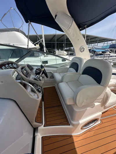 Don't Blink Yacht Photos Pics 2005 Sea Ray 340 Sundancer helm with dual seats and modern controls.