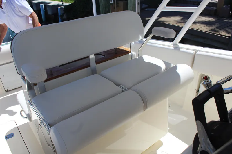  Yacht Photos Pics 2008 Pursuit S 310 Sport boat interior with white cushioned seating.