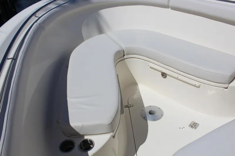  Yacht Photos Pics 2008 Pursuit S 310 Sport boat interior with white cushioned seating.