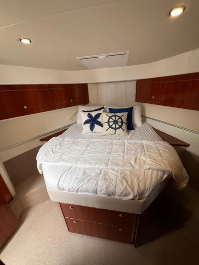 No Name Yacht Photos Pics Luxurious bedroom in 2016 Riviera 45 OPEN yacht with nautical-themed decor.