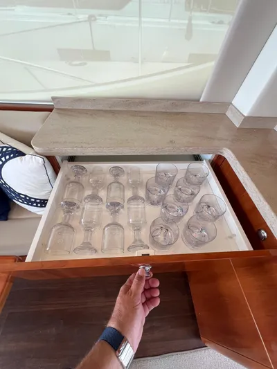 No Name Yacht Photos Pics Drawer with glassware in 2016 Riviera 45 OPEN yacht interior.