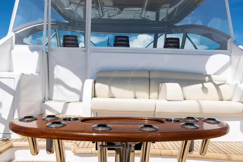  Yacht Photos Pics 2021 Viking 44 Open yacht interior with luxurious seating and polished wooden table.